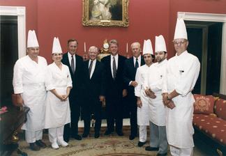Formal group photo in elegant White House room